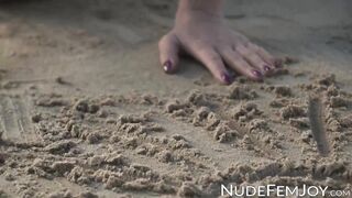 Perfect goddess like Natalie E having fun teasing herself in the white sand